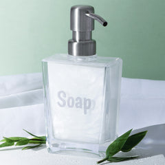 soap dispenser over green background