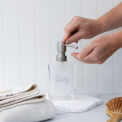 soap dispenser used by woman