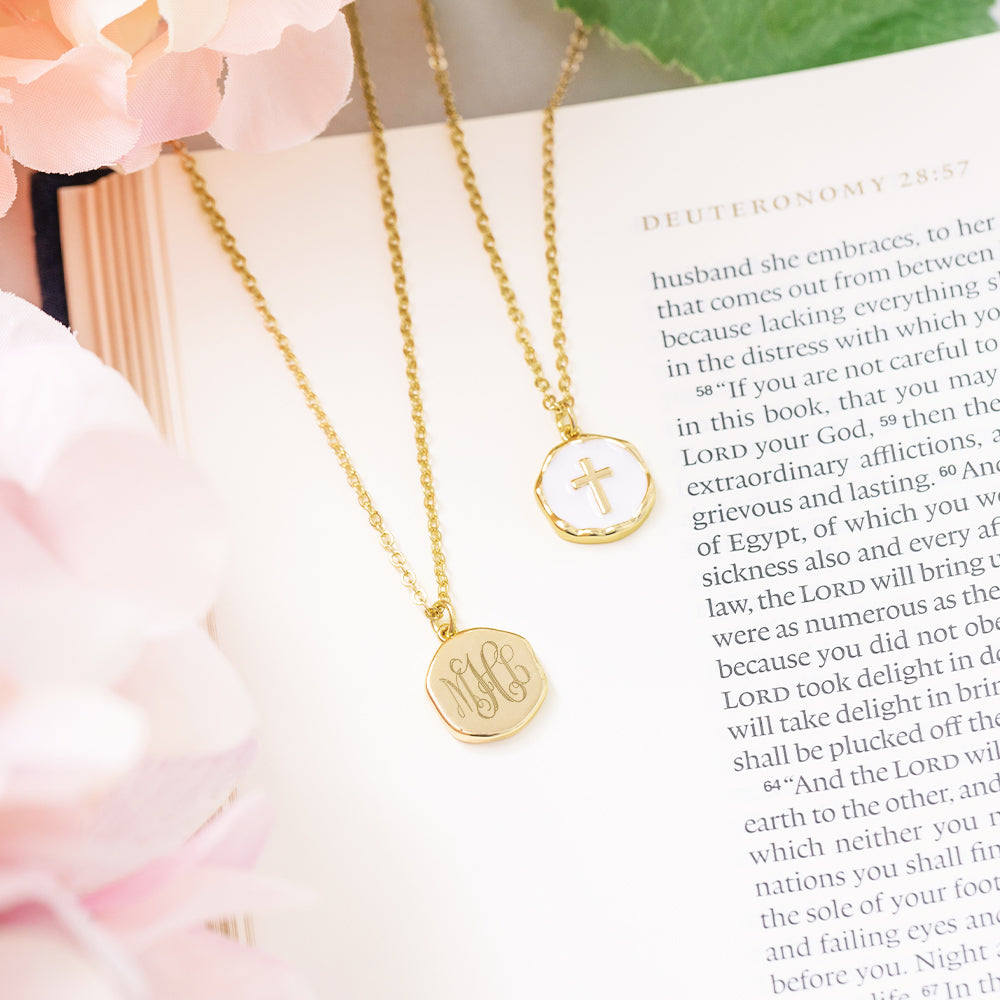 white monogrammed reversible cross necklace front and back on bible