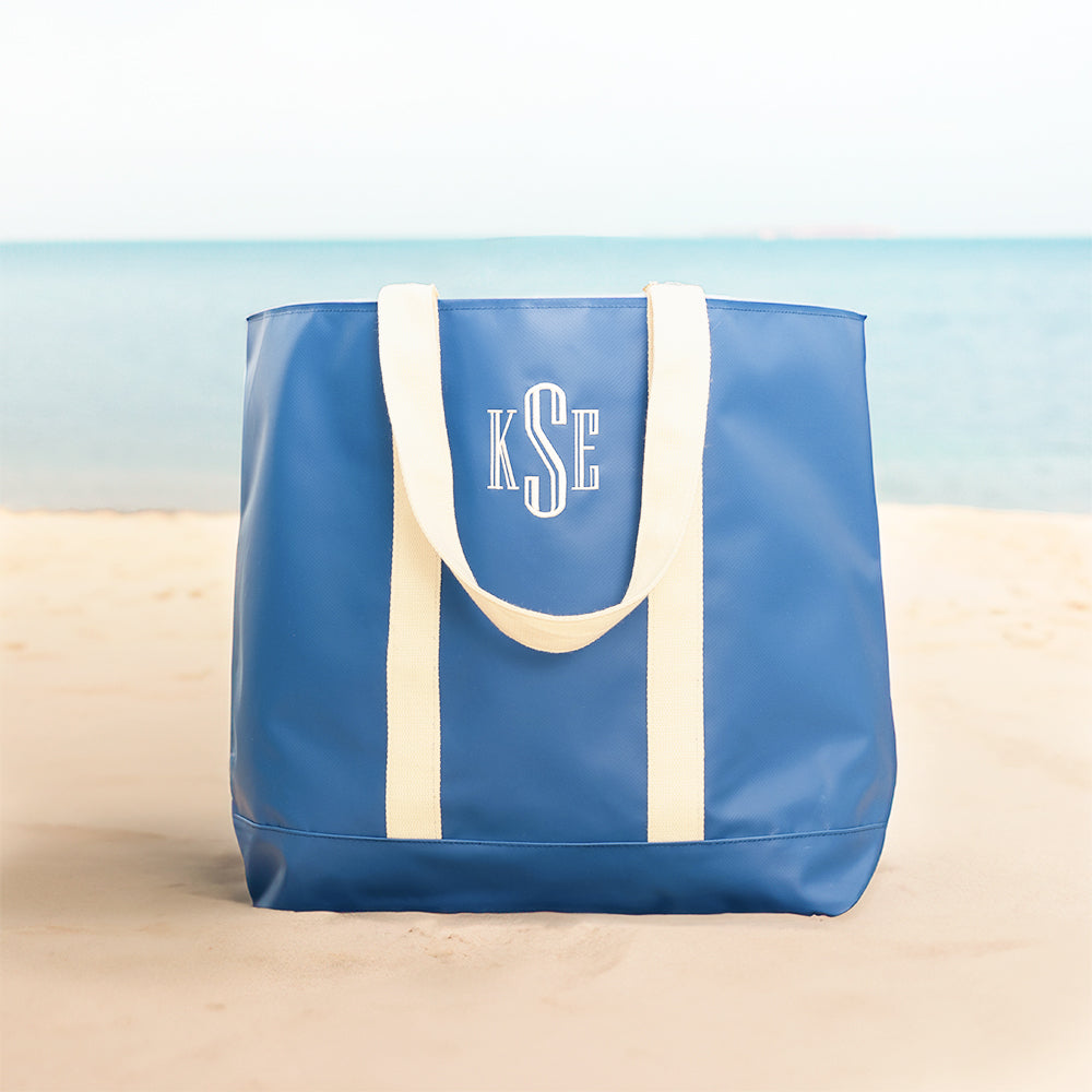 blue waterproof tote on beach