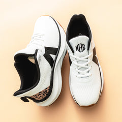 white leopard sneakers studio shot
