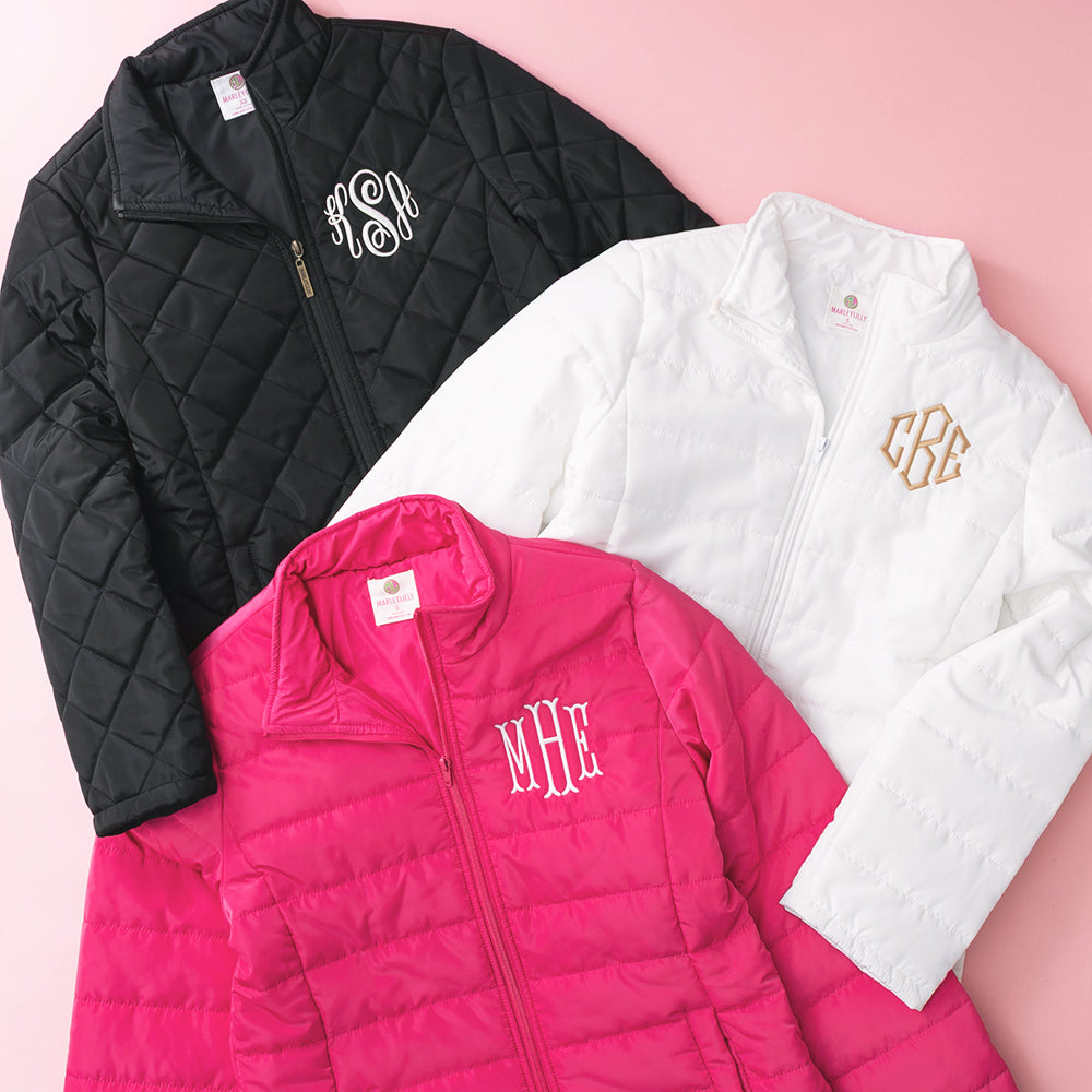 black white and hot pink monogrammed puffer jackets