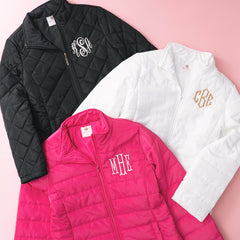 black white and hot pink monogrammed puffer jackets