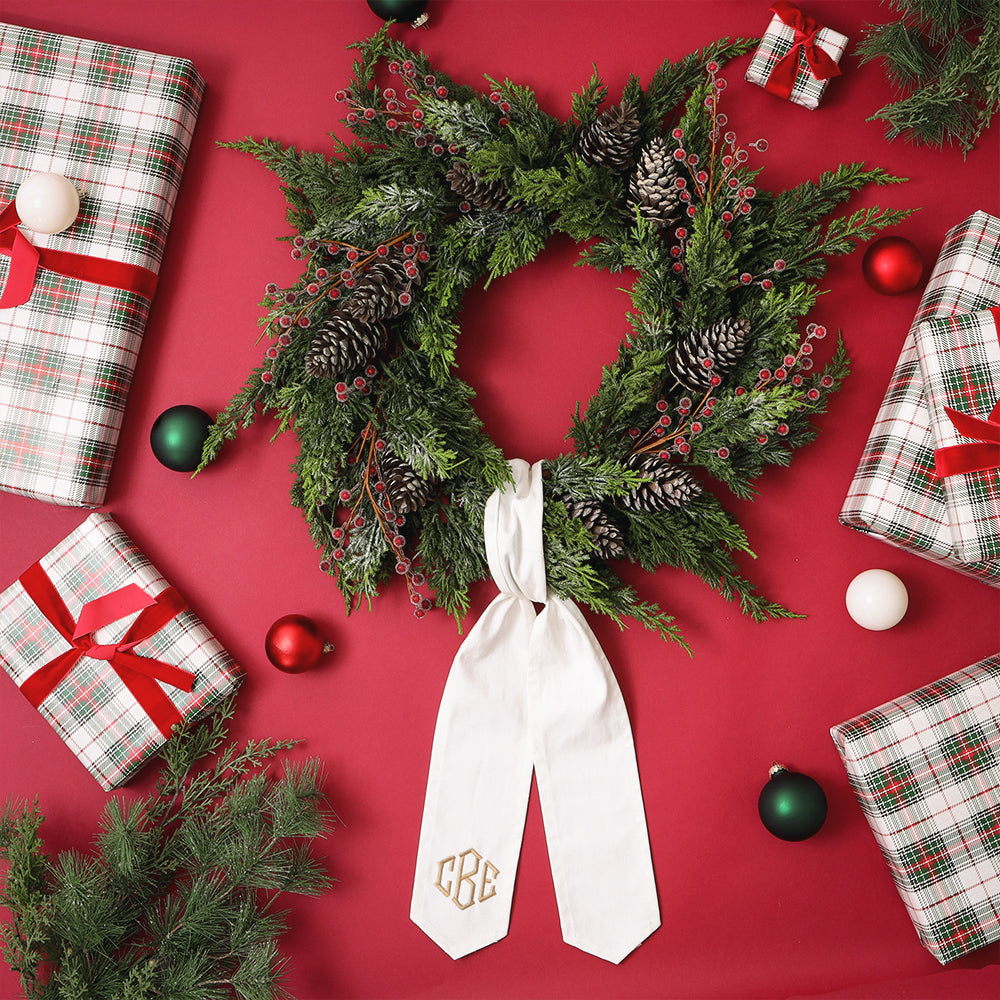 ivory wreath sash on red background