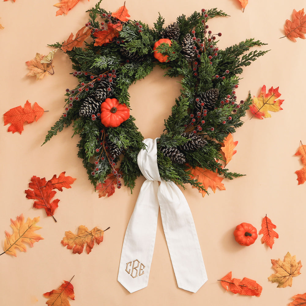 ivory wreath sash with fall decorations