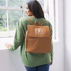 girl with monogrammed diaper backpack purse on back