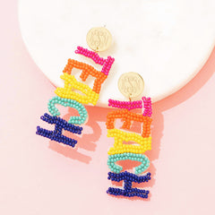multi teacher earrings on marble dish