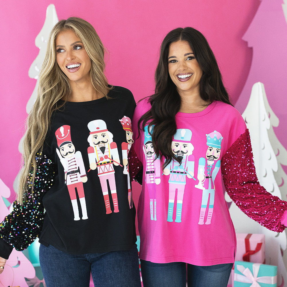 [rachel, peyton] 2 girls wearing monogrammed nutcracker sweatshirts close up