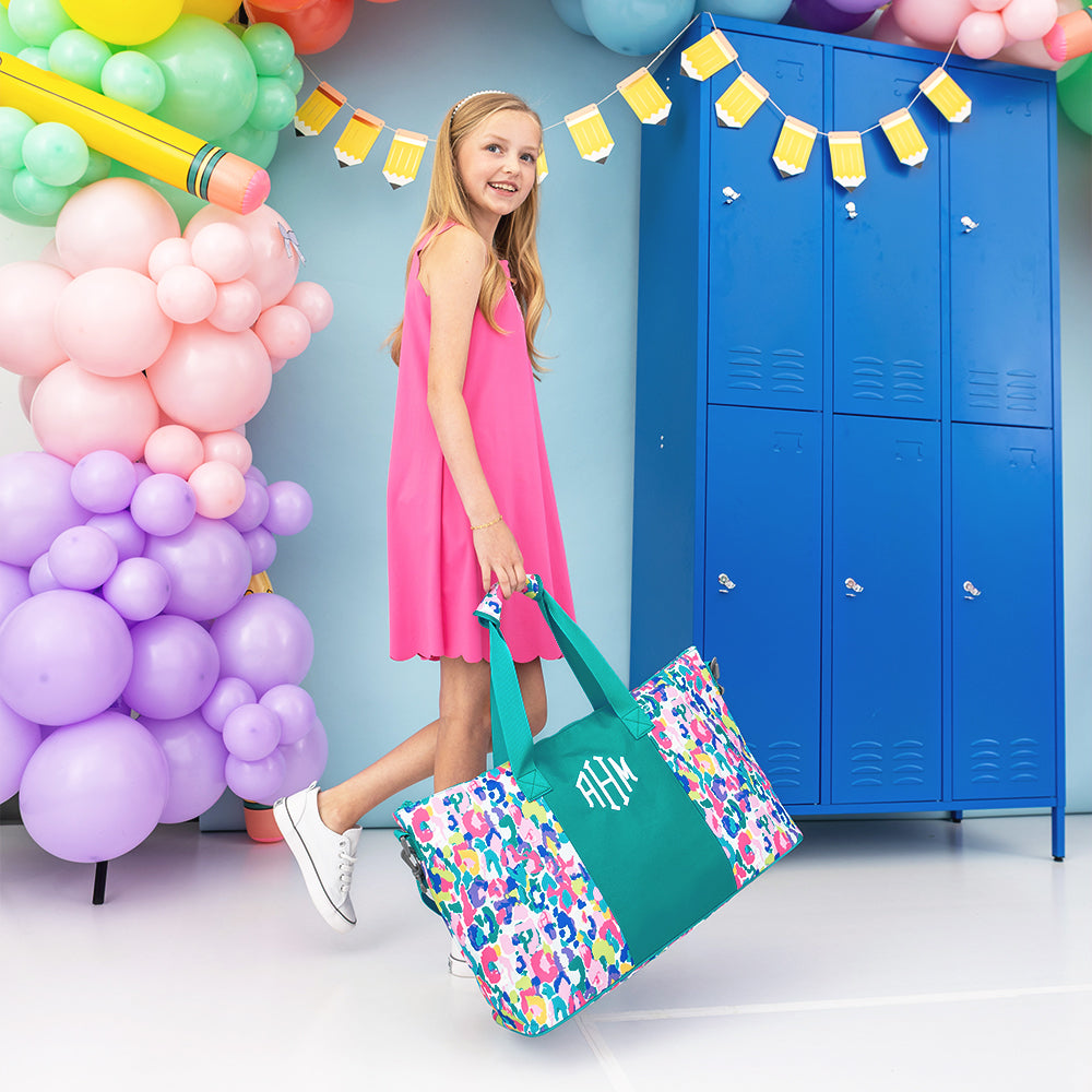 2026 watercolor cheetah kids weekend bag carried by girl