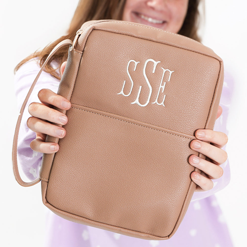tan bible carrier in hands