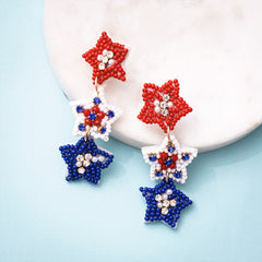 patriotic earrings on marble dish