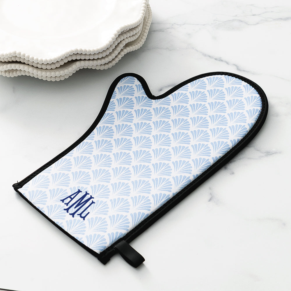blue shell oven mitt on counter