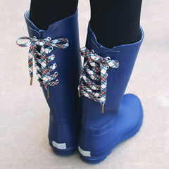 plaid shoe laces on navy rain boots
