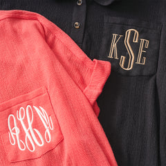 coral and black monogrammed tops up close