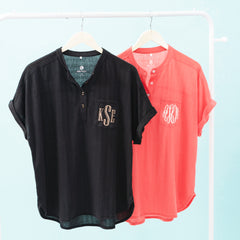 duo monogrammed tops in black and coral