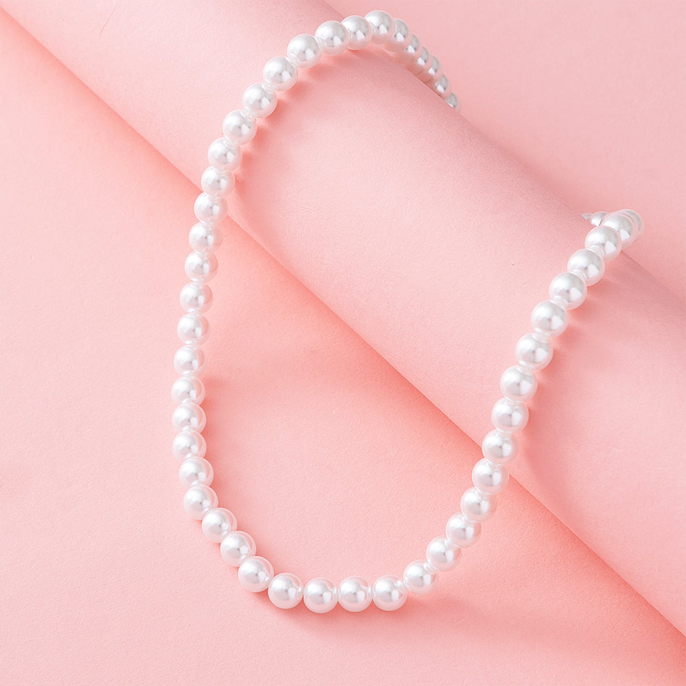pearl necklace nm on pink