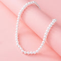 pearl necklace nm on pink