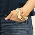 pink monogrammed beaded bracelet stack on wrist