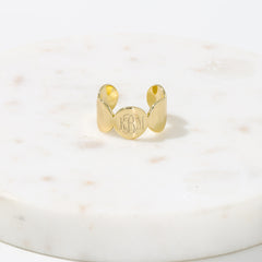 gold cuff ring on marble