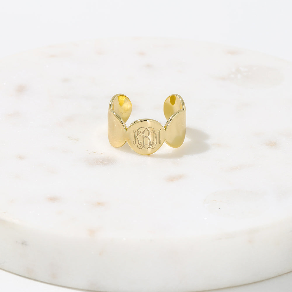 gold cuff ring on marble