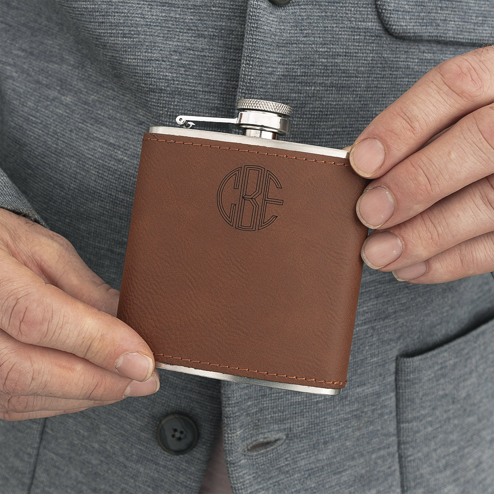 man holding personalized leather wrapped flask