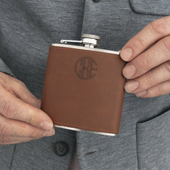 man holding personalized leather wrapped flask