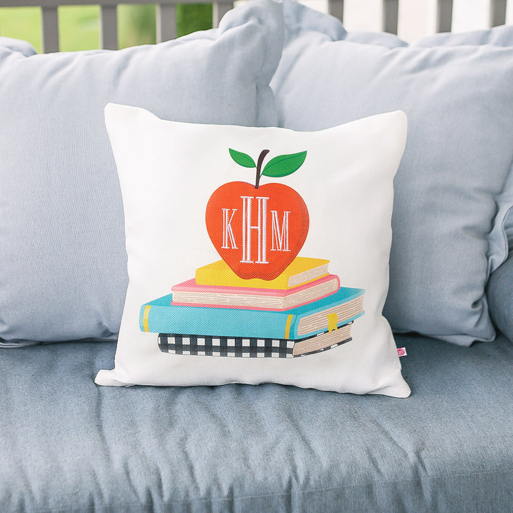 teacher monogrammed pillow sham in apples and books outside