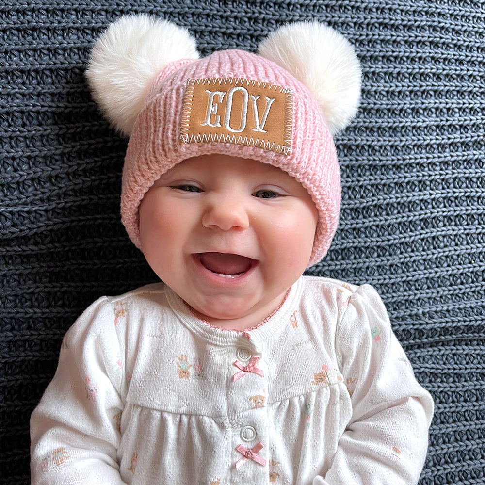pom pom beanie on baby girl