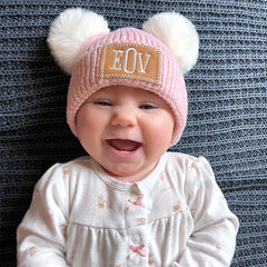 pom pom beanie on baby girl