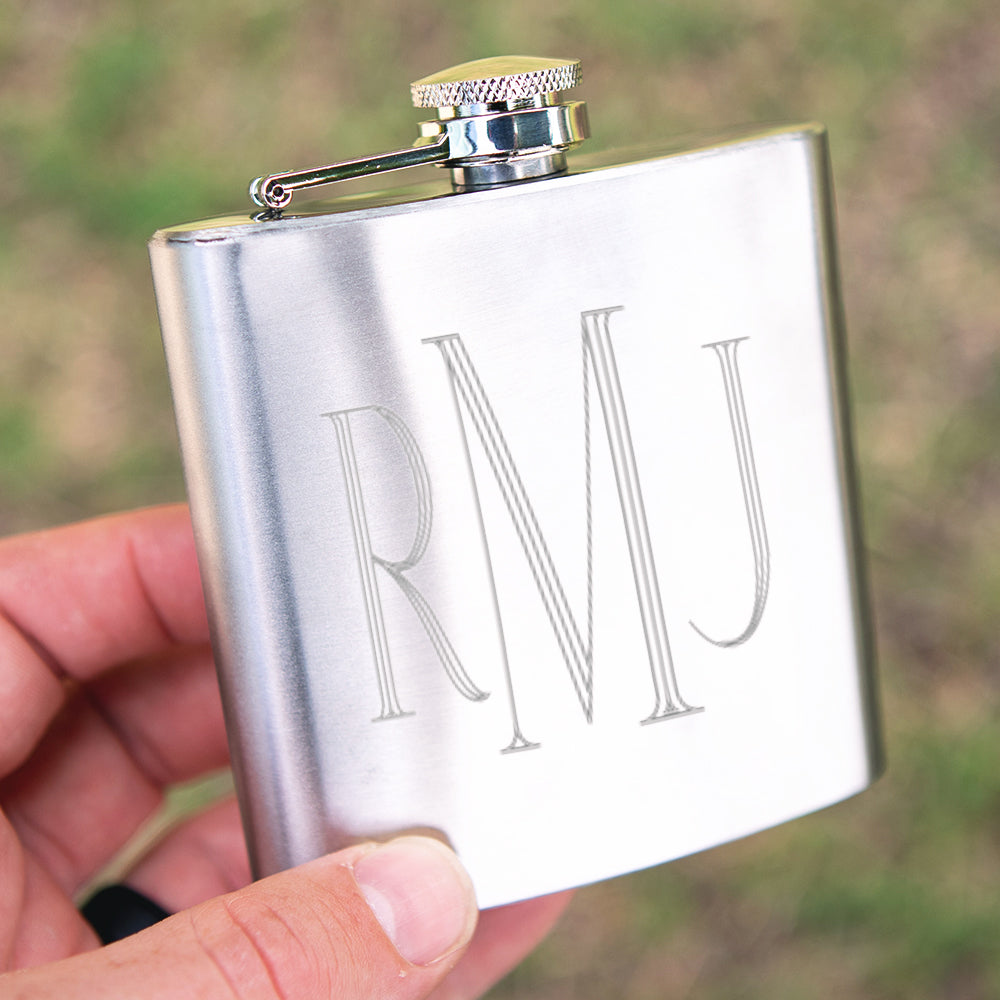 silver flask being held