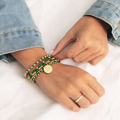 green gameday bracelet on wrist