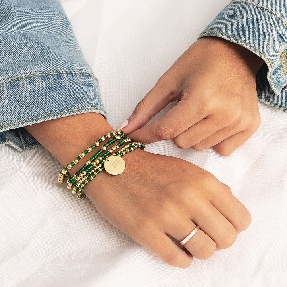 green gameday bracelet on wrist