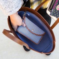 Matching gingham pouch clipped into inside lining of leather tote
