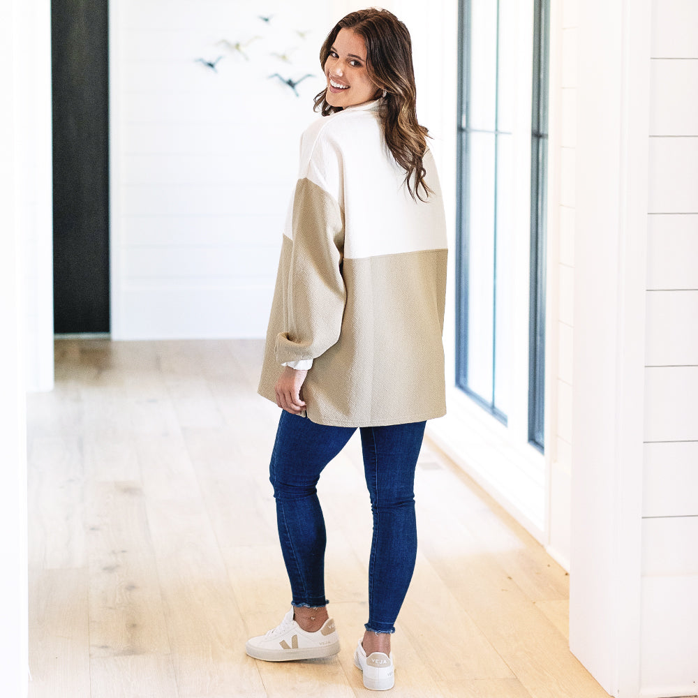 back of monogrammed quilted pullover tunic in tan
