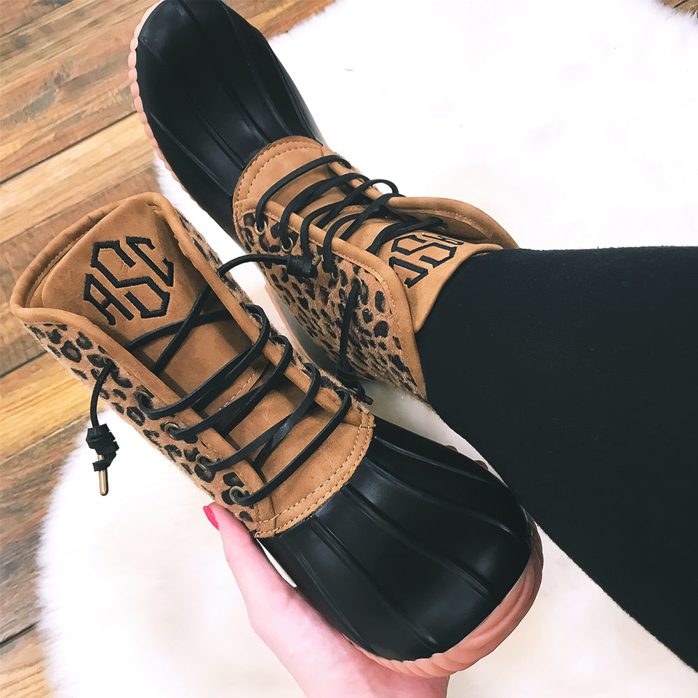 black suede curled laces on leopard duck boots