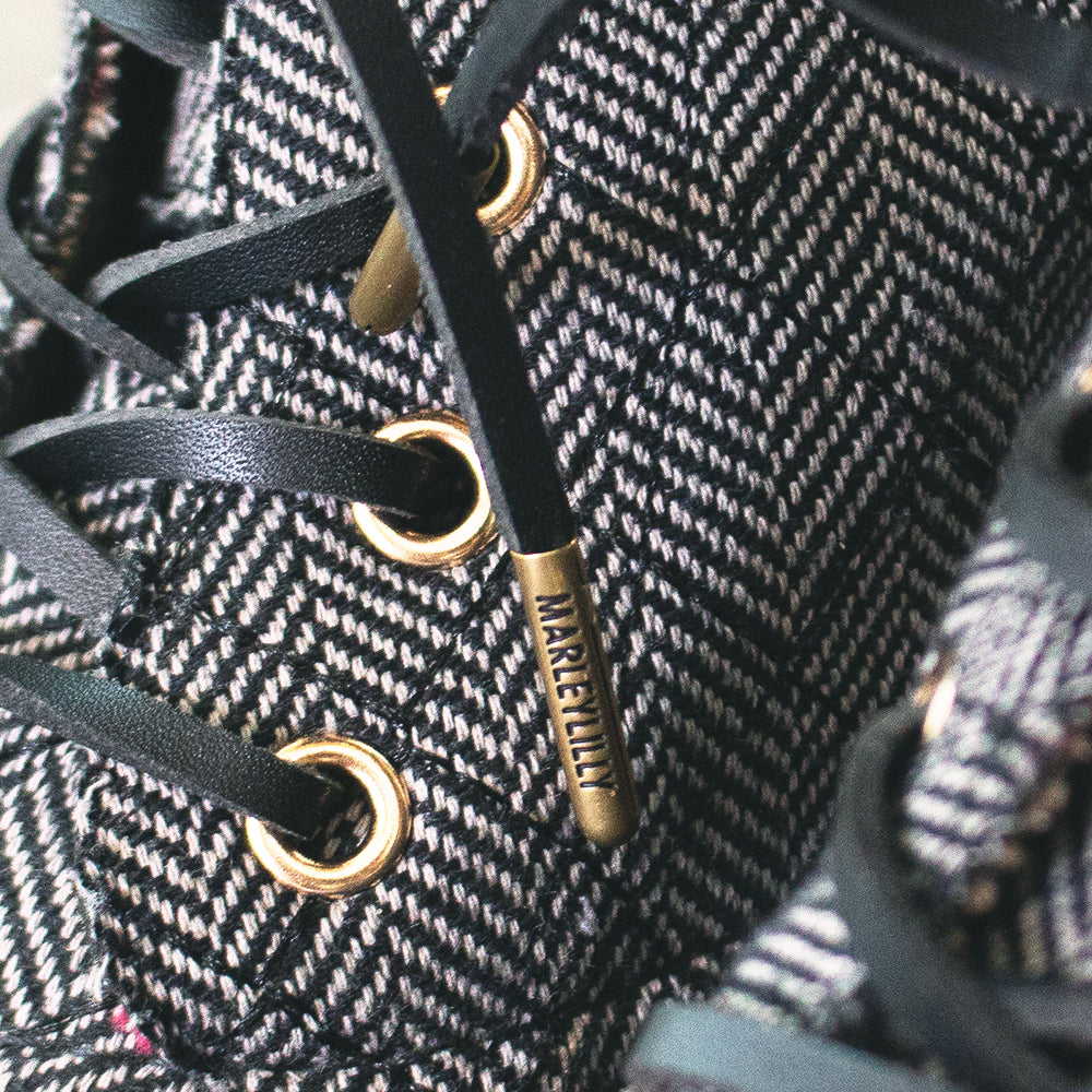 branding on end of black suede shoelaces