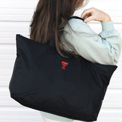 Texas Tech Packable Duffel Bag on Shoulder