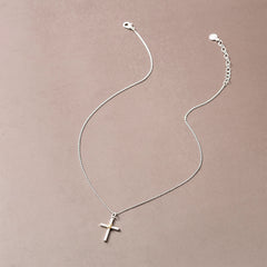 cable cross necklace on brown