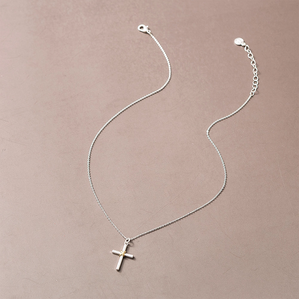 cable cross necklace on brown