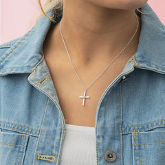 girl wearing cable cross necklace