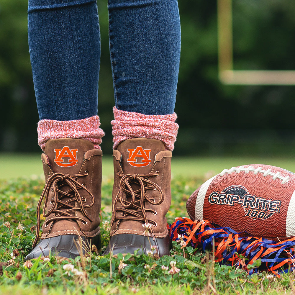 auburn duck boots with orange socks on football field