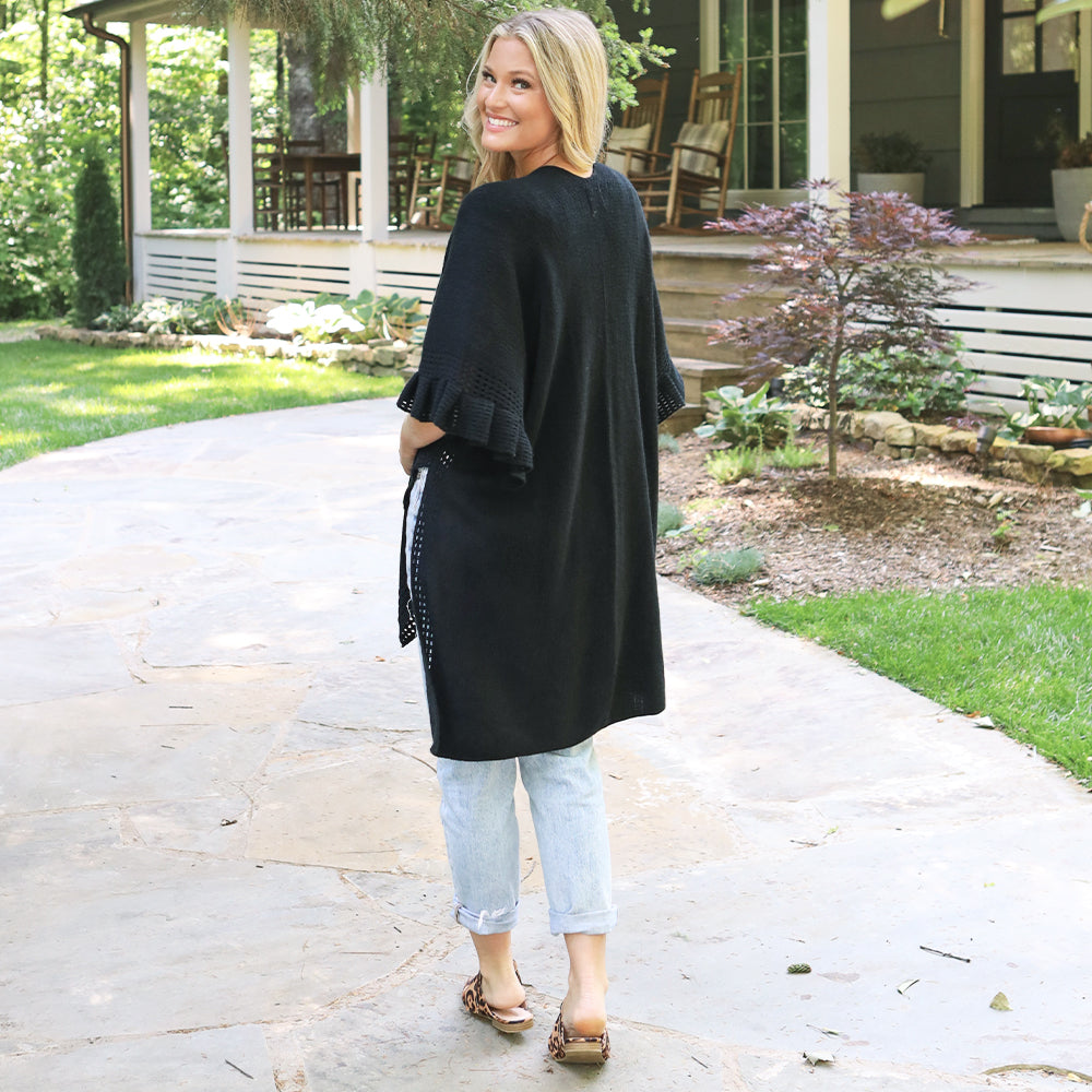 back of black cardigan poncho