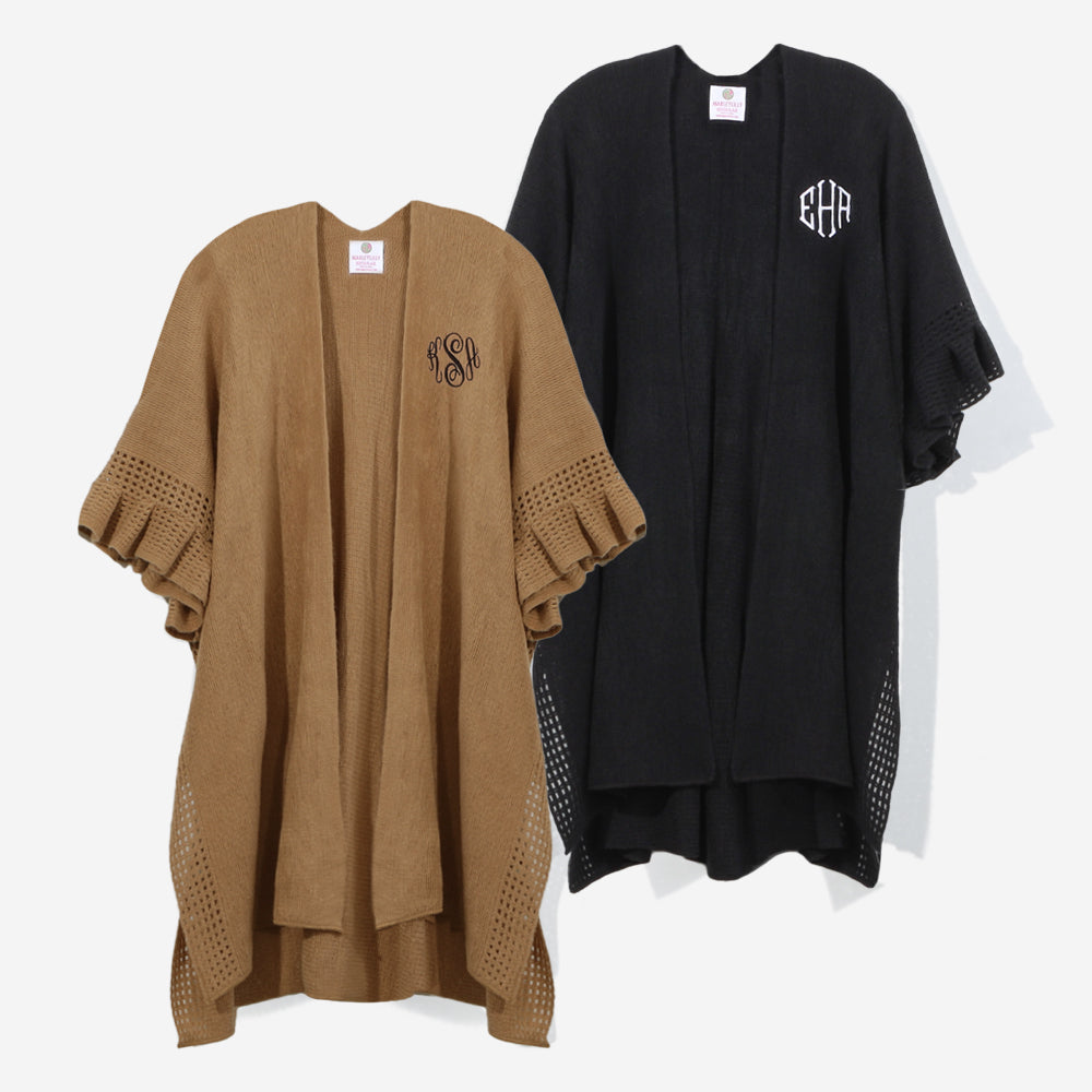 monogrammed poncho cardigan in black and camel