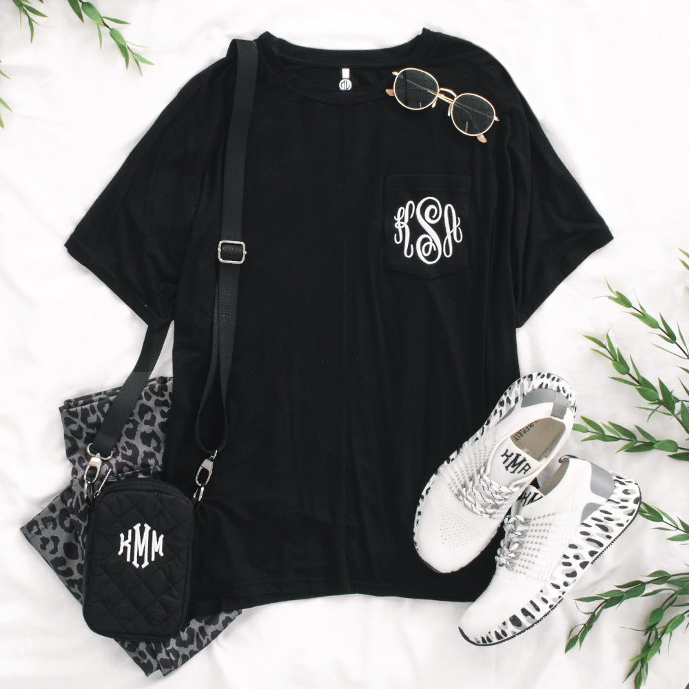 black monogrammed tee with crossbody bag outfit