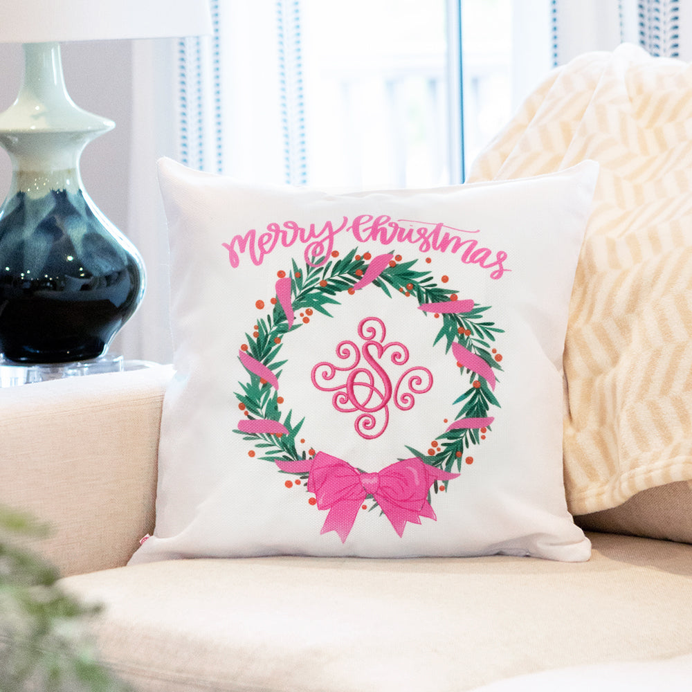 christmas pink wreath monogrammed pillow sham on couch