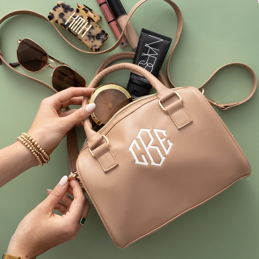 tan harper handbag spill shot with makeup