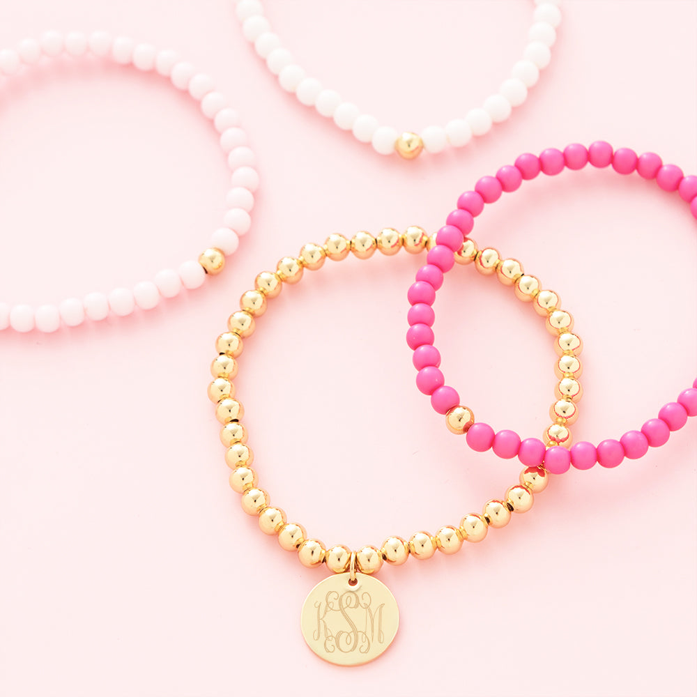 pink beaded bracelet set flatlay