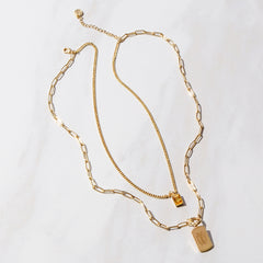 full view of monogrammed tag necklace