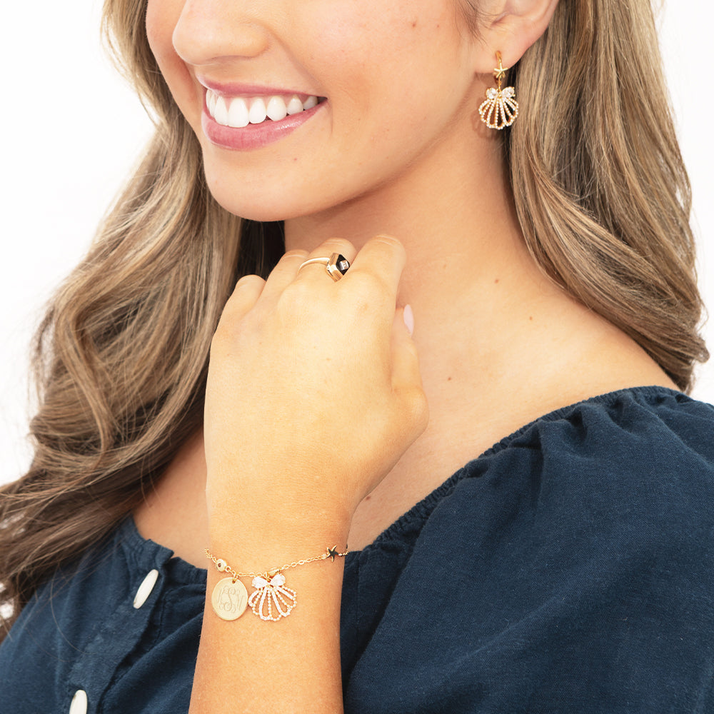 shell bracelet set on arm and ear