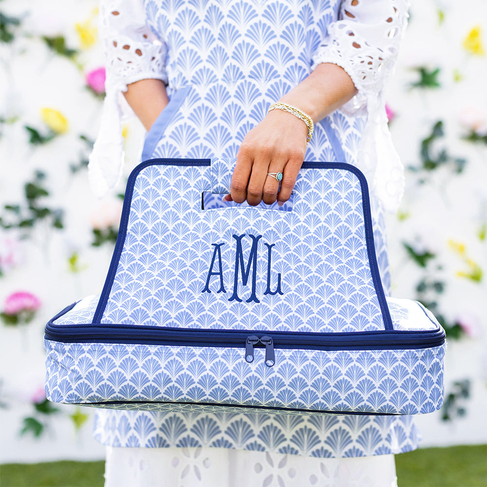 blue shells casserole carrier in hand